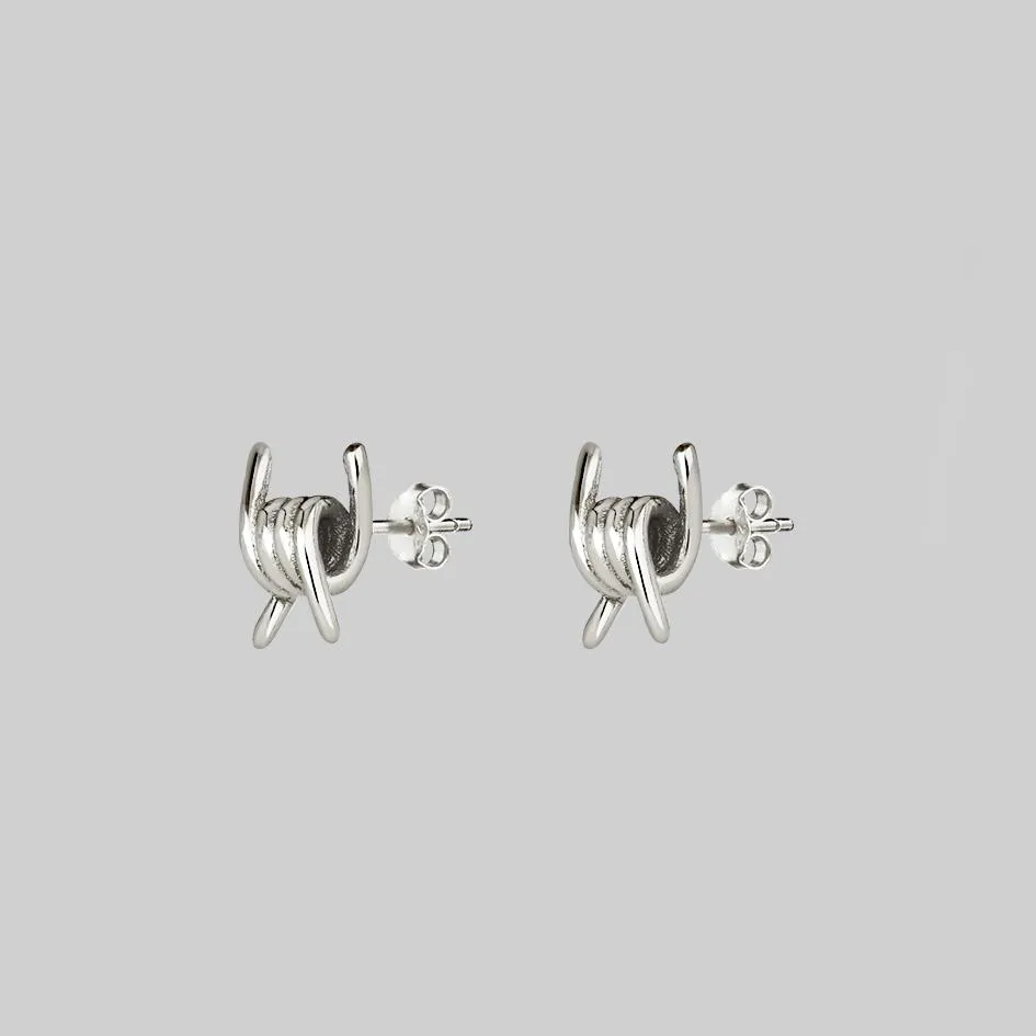 SURVIVAL. Symbolic Barbed Wire Stud Earrings - Silver